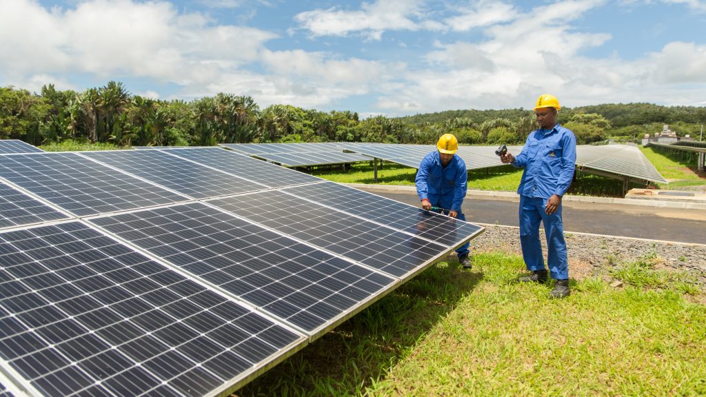 Photovoltaic technicians at Henrietta PV plant in Mauritius Jasvirsing Jeetul (on the left) and Fabien D'Albrede are Photo Voltaic Technicians at CEB Green Energy Company Limited. December 2019. Photo credit: Stéphane Bellerose/UNDP in Mauritius and Seychelles.
