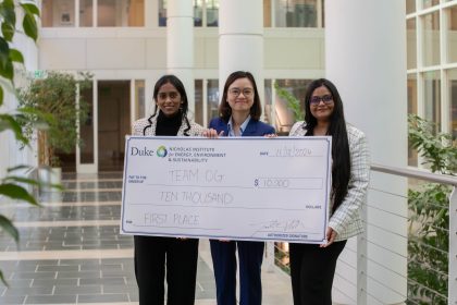 The winners of the 2024 Energy in Emerging Markets Case Competition from Syracuse University holding a big check with the prize money of $10,000.